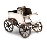 A novelty electroplated table vesta holder, unmarked, modelled as an early vintage car with a