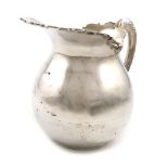 An American silver jug, by A. T. Gunner and Co, baluster form, leaf capped scroll handle, foliate