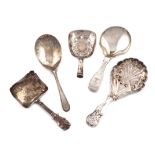 A collection of five antique silver caddy spoons, various dates and makers, including: a Victorian