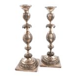 A pair of late 19th century Russian silver candlesticks, maker's mark possibly MK, Vilnus,