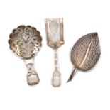 A small collection of three antique silver caddy spoons, comprising: one of leaf form, by Matthew