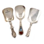 A small collection of three silver caddy spoons, comprising: a Victorian one, by Hilliard and