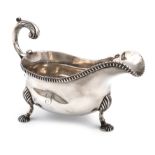 A George III silver sauce boat, possibly by William Abdy, London 1811, oval form, leaf capped scroll