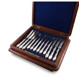 A set of twelve Victorian silver fruit knives and forks, by Joseph Rodgers & Sons, Sheffield 1864,