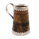 A Charles II silver-mounted horn mug, unmarked, circa 1680, tapering circular form, reeded scroll