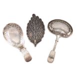 A small collection of three antique silver caddy spoons, comprising: one by Cocks and Bettridge,