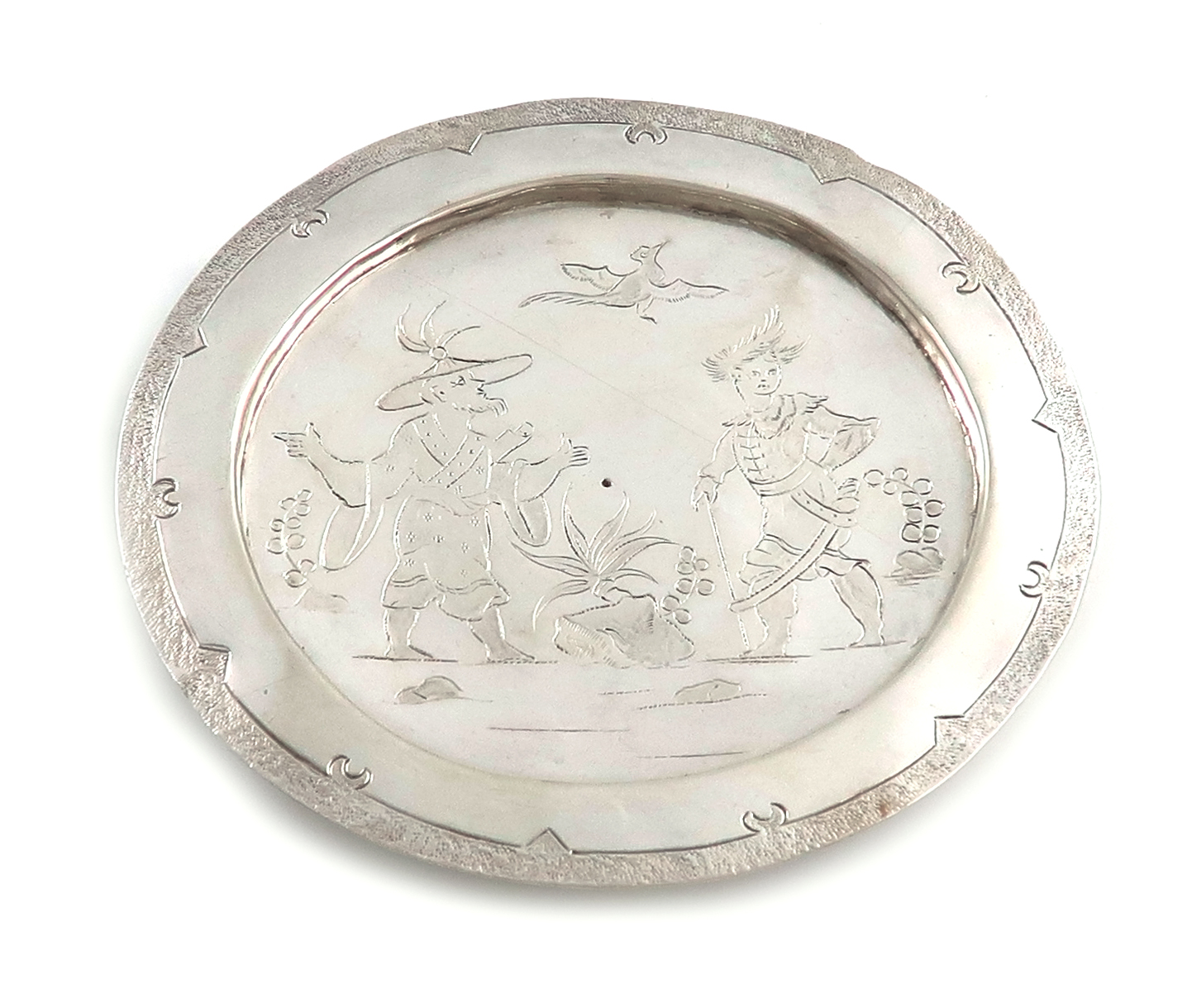 A late 17th century silver West Country paten or small footed dish in the Chinoiserie manner, by