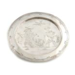 A late 17th century silver West Country paten or small footed dish in the Chinoiserie manner, by