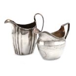 A George III silver cream jug, by Elizabeth Morley, London 1806, oval bellied form, scroll handle,