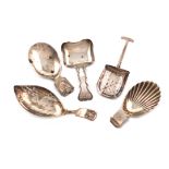 A collection of five antique silver caddy spoons, various dates and makers, including: a George