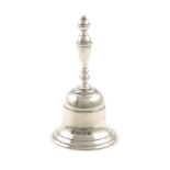A silver table bell, by R. Comyns, London 1927, plain form, baluster handle, height 10.5cm,