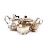 λA small collection of silver tea wares, comprising: a tea pot and sugar bowl of panelled circular