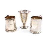 A collection of three silver christening mugs, comprising: an Arts and Crafts one, by Arnold &