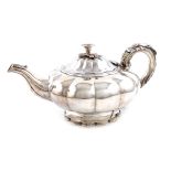 λA William IV presentation silver teapot, by Joseph Angell, London 1830, lobed circular form, the
