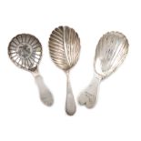 A small collection of three antique Irish and Scottish silver caddy spoons, comprising: one by