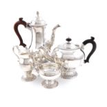 A matched modern four-piece silver tea and coffee set, by JCL, London 1968 and 1970, the coffee