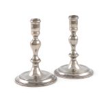 A pair of Queen Anne silver taper sticks, by Jacob Margas, London 1708, octagonal baluster form,