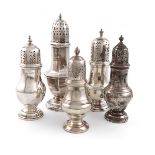 A small collection of five silver casters, comprising: one of octagonal form, by William Adams