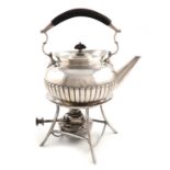 An Edwardian silver kettle on a matched stand, by Heath and Middleton, Birmingham 1907, the stand