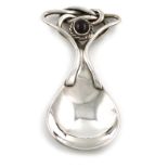 A modern silver caddy spoon in the Omar Ramsden manner, by RB ltd, London 2005, spot hammered fig