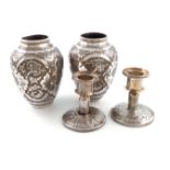 A pair of Persian metalware vases, baluster form, chased foliate decoration, height 12cm, plus a