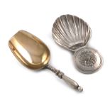 A Russian silver caddy spoon, 1896-1908, shovel form, gilded bowl, the reverse with initials, the