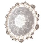 A George III silver salver, maker's mark T.P, London 1780, circular form, shell and scroll border,