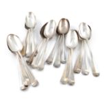 A collection of eighteen George II/III silver Hanoverian pattern tablespoons, various dates and