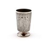By Gerald Benney, a modern silver goblet, London 1968, textured decoration, plain rim, on a raised