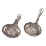 A George IV silver caddy spoon, by John Bettridge, Birmingham 1822, the oval bowl embossed with a