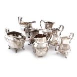 A collection of seven silver cream jugs, various dates and makers, including a George II one, of