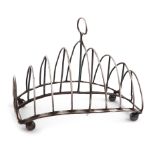 A George III silver nine-bar toast rack, by Peter, Ann and William Bateman, London 1801, rounded