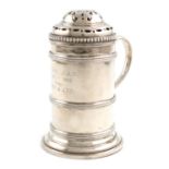 A silver flour shaker, by Fowler & Polglaze Ltd, London 1935, cylindrical form, scroll handle, the