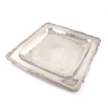 A Columbian metalware serving platter, unmarked, square form, moulded border, length 39.5cm.