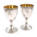 A pair of George III silver goblets, by Robert Hennell I, London 1794, urn shaped bowls, gilded