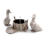 A three-piece modern novelty silver condiment set, by R. Comyns, London 1973, the salt and pepper