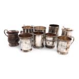 A collection of nine small silver mugs, comprising: one by the Atkin Brothers, Sheffield 1906,