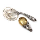 By Tiffany and Co., an American parcel-gilt silver caddy spoon, shell bowl, pierced foliate and