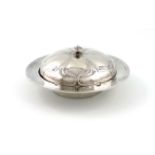 Designed by Oliver Baker for Liberty, an Art Nouveau silver muffin dish and cover, Birmingham 1900