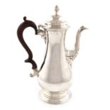 A George III silver coffee pot, by Whipham & Wright, London 1763, baluster form, scroll handle,