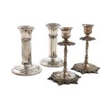 A pair of dwarf silver candlesticks, by The Boots Pure Drug Company, Birmingham 1919, circular
