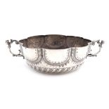 A two-handled silver bowl, by Henry Lambert, London 1912, lobed circular form, caryatid scroll