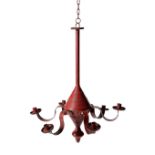 A FOLK ART RED PAINTED TOLE CHANDELIER POSSIBLY FRENCH, 19TH CENTURY with six scroll arms and a