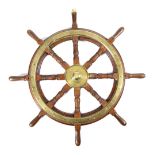 A TEAK BRASS MOUNTED SHIP'S WHEEL 19TH CENTURY with eight turned and block spokes 92cm diameter