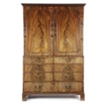 A GEORGE III MAHOGANY LINEN PRESS C.1770 the detachable dentil cornice above a pair of flame
