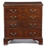 A GEORGE III MAHOGANY CHEST C.1770 the top with a moulded edge, above a brushing slide and four long