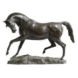 AN ANIMALIER EQUESTRIAN BRONZE LATE 19TH CENTURY depicting a prancing Arabian stallion, on a