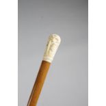 λ AN IVORY HANDLED WALKING CANE LATE 19TH / EARLY 20TH CENTURY in Renaissance revival style, the