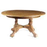 A LATE VICTORIAN OAK EXTENDING DINING TABLE BY W. WALKER & SONS, C.1880-90 the circular moulded edge