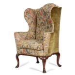 A GEORGE I WALNUT WING ARMCHAIR C.1725 later upholstered with 18th century style gros point